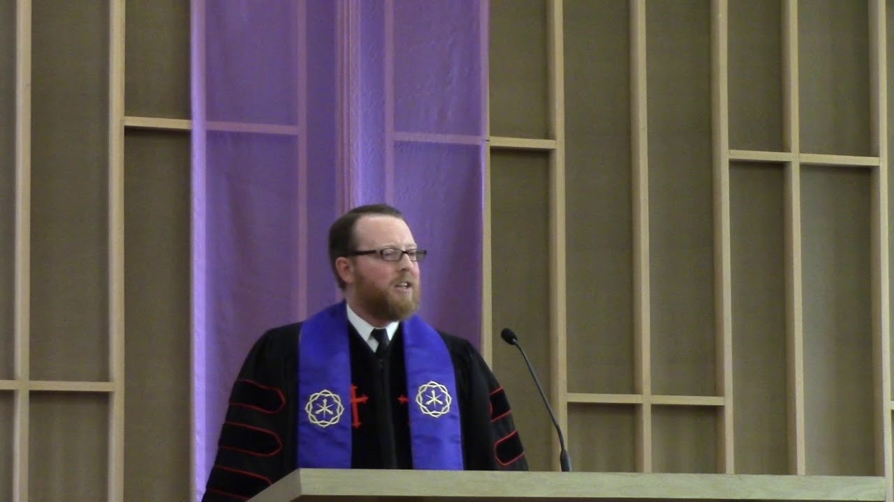 Senior Minister David Kaden standing at the pulpit giving a sermon