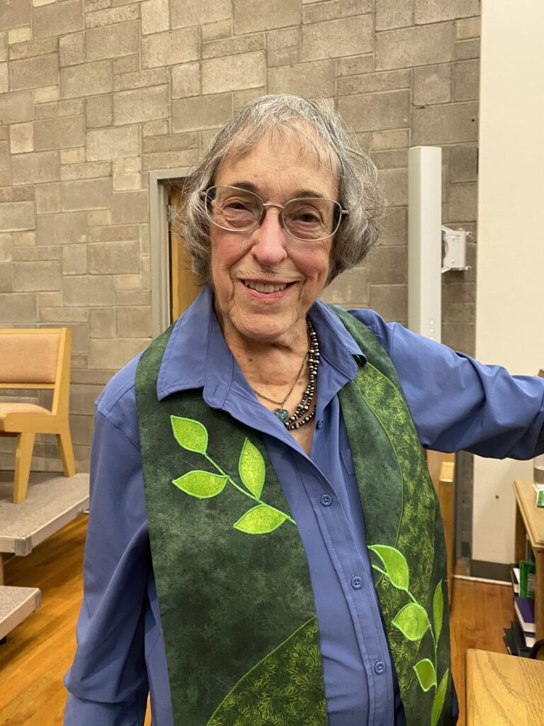 Rev. Susan Fast wearing a green stole